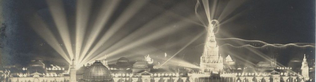 Photograph of a postcard depicting a night scene of a city