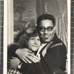 black and white photograph of a man and woman hugging