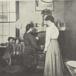 Photograph of a women helping 3 poor children