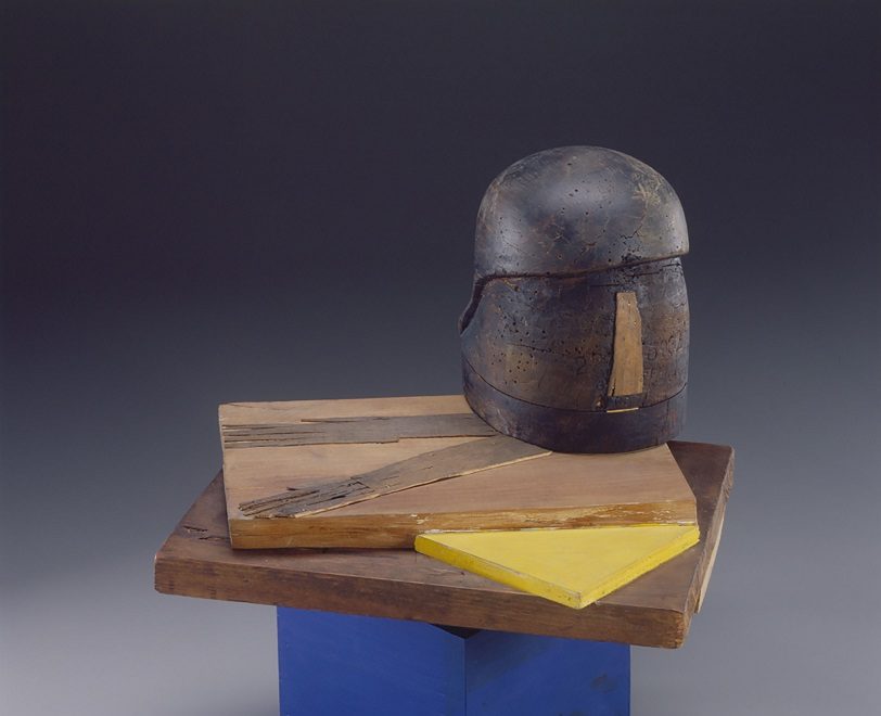 Photo of an abstract art piece made of several types of wood of different colors and other materials
