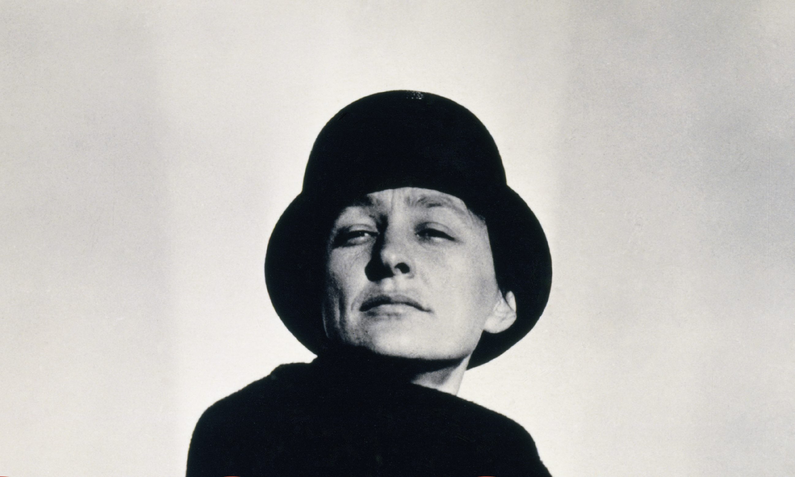 Book cover for "Georgia O'Keeffe Living Modern" featuring a woman wearing black clothes and a black hat