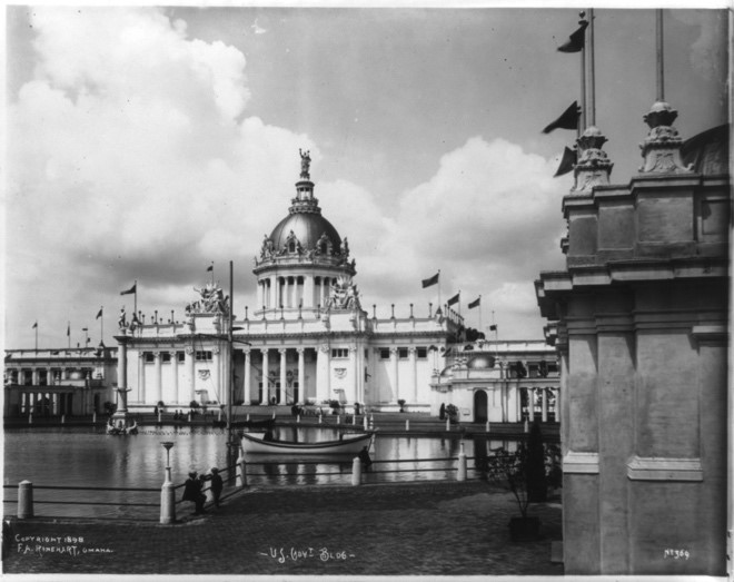Image of an ornate building with columns and a dome that is situated along the riverfront