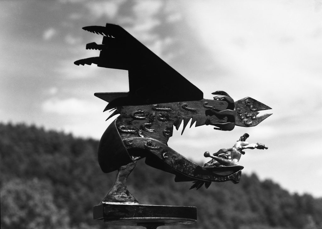 black and white photograph of bronze sculpture in the form of an abstracted bird of prey