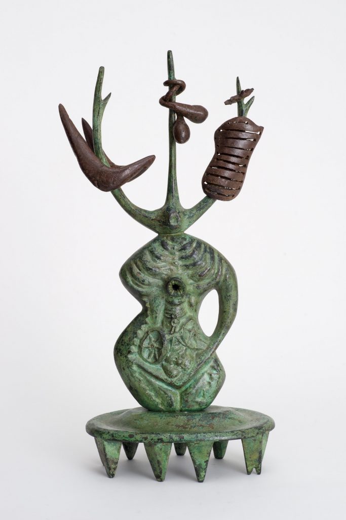 Abstract bronze sculpture with areas of green patina