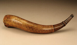 Color photograph of a seventeenth-century powder horn