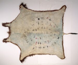 Outstretched animal hide with drawn decorations on the interior, arranged in concentric circles