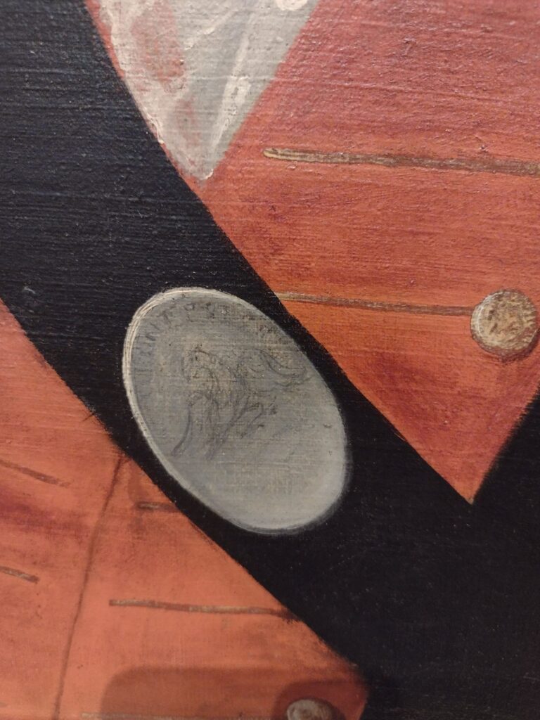 Detail of a painting representing the button front of a coat, a black diagonal sash, and a medal on which is drawn an eagle and some illegible words