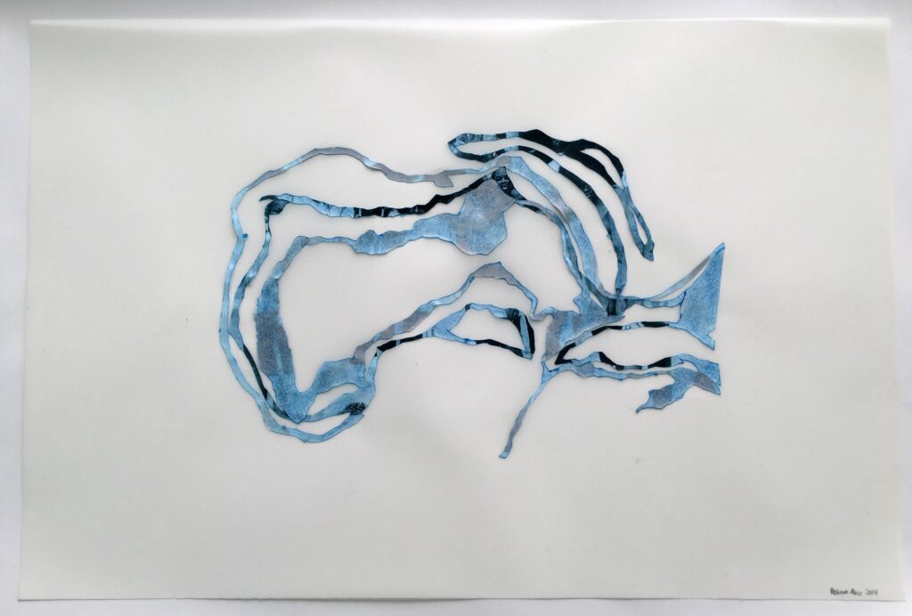 Artwork composed of seaweed-like cutout forms in black, blue, and silver against a white wall