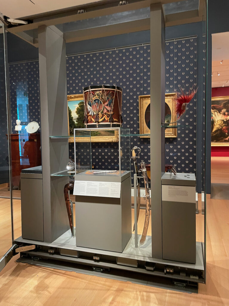 Interior of a museum gallery featuring colonial and 19th-century American objects