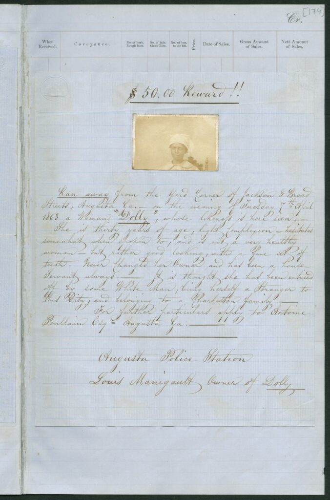 Handwritten document on blue paper, with a photograph of an African American woman under the words "$50.00 Reward!!"