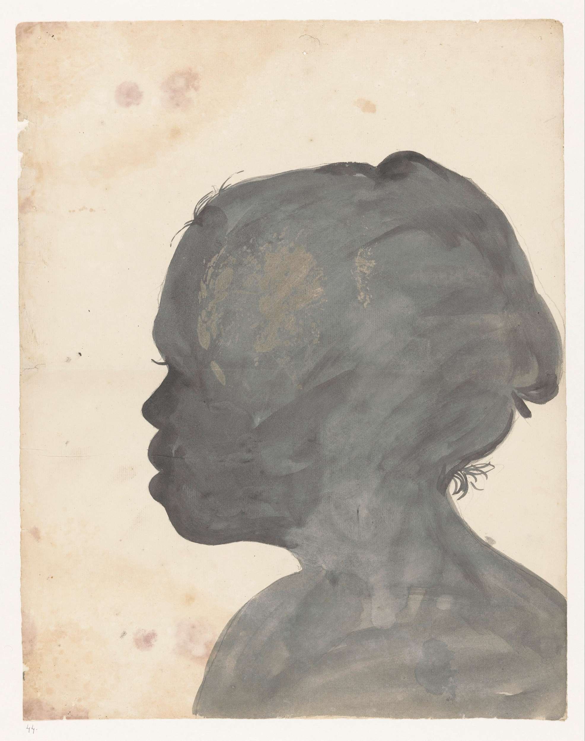 Painted silhouette of a non-European woman facing left