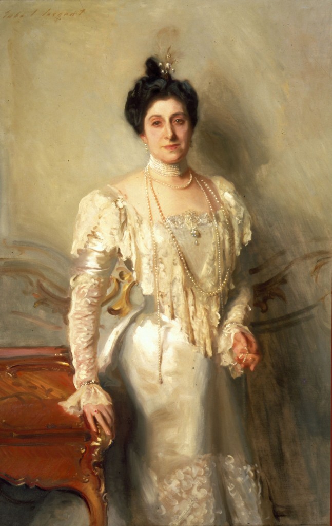 Oil painting of a middle-aged woman with dark hair wearing an ornate white evening gown with ropes of pearls around her neck.