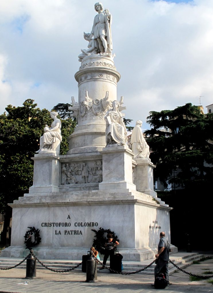 Public monument consisting of amarble statue of Christopher Columbus atop an elaborate marble base, flanked by robed female figures. An inscription on the base reads "A / CRISTOFORO COLOMBO / LA PATRIA"