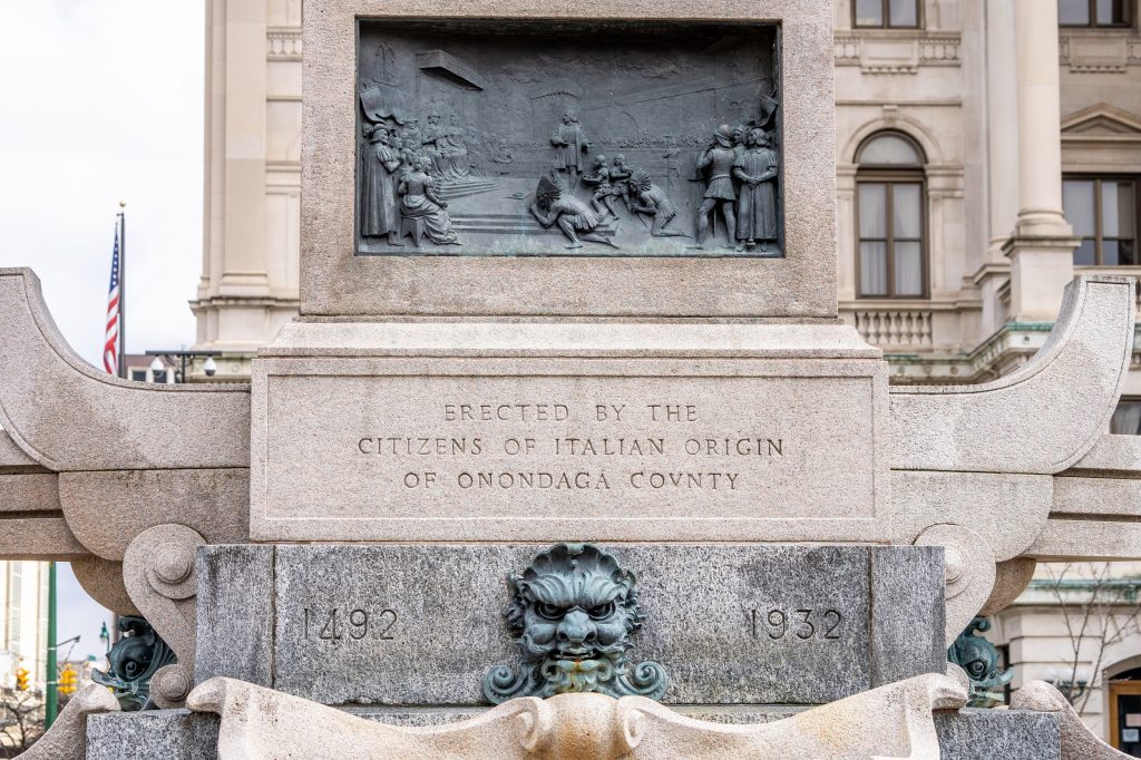 Detail of the base of the monument seen in fig. 3; an inscription reads "ERECTED BY THE / CITIZENS OF ITALIAN ORIGIN / OF ONANDAGA COUNTY"