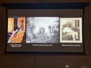Screen in darkened theater with three side-by-side slides: a painting titled "The Reflection" by William Merritt Chase; a black-and-white photograph of the interior of a room at The Elms, a mansion in Newport; and a black-and-white photograph of William Howard Taft from 1901-3.