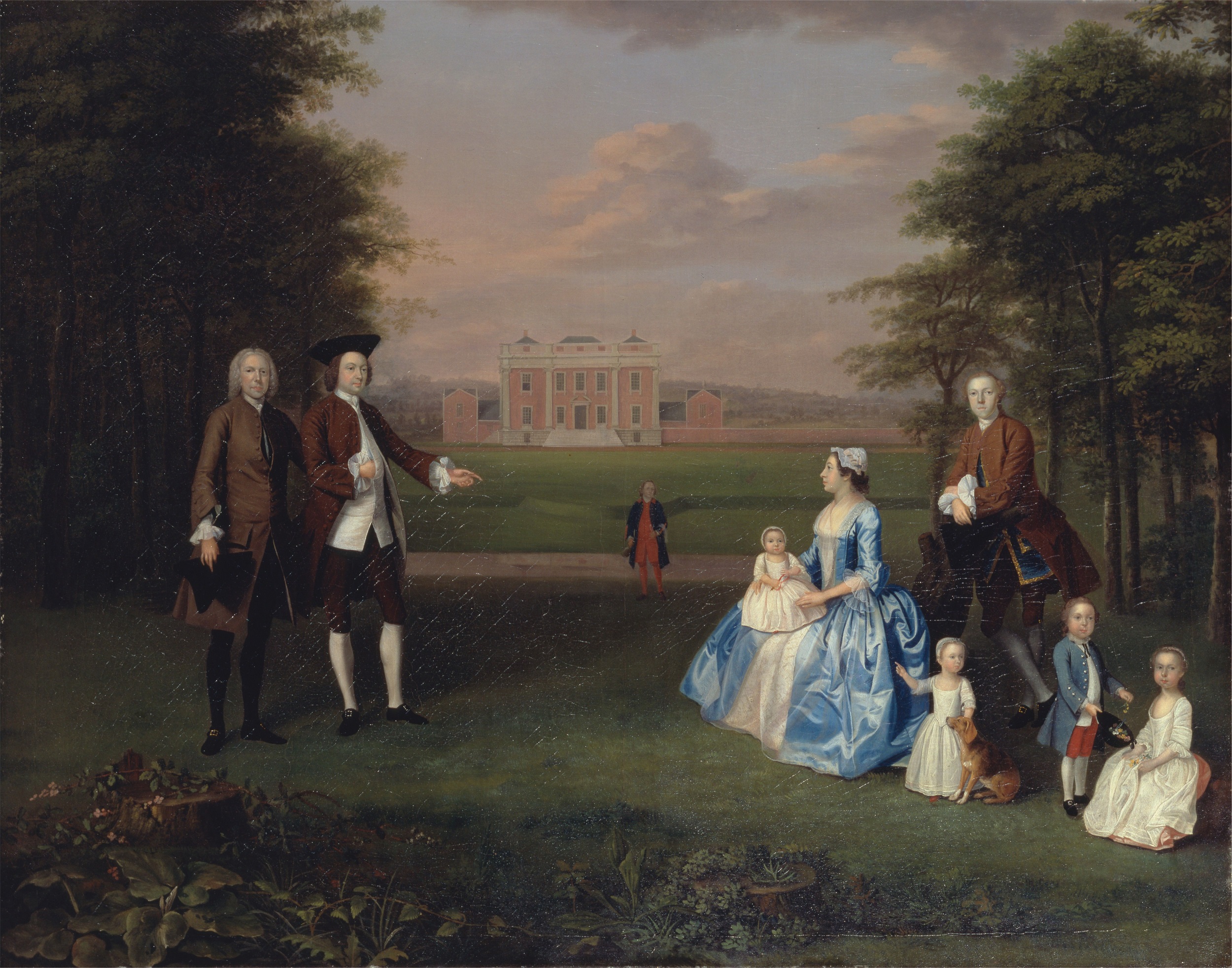 Oil painting of a European family with four men, one woman in a blue silk dress, and four children, seated in a landscape with a large estate in the background.