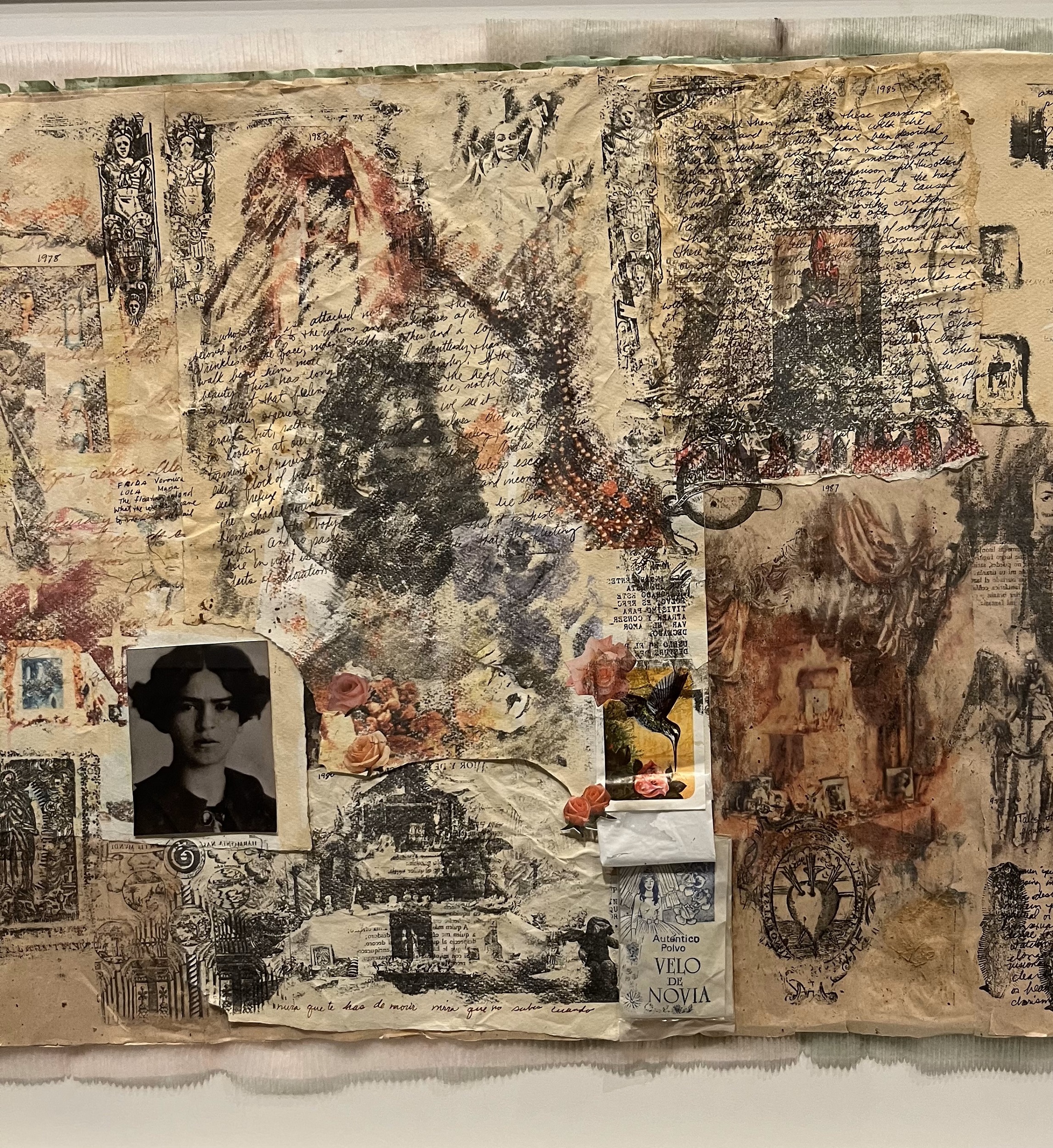Collaged composition with passages of fire-like drawing and handwriting; a small black-and-white photograph of a woman's face is in the lower left