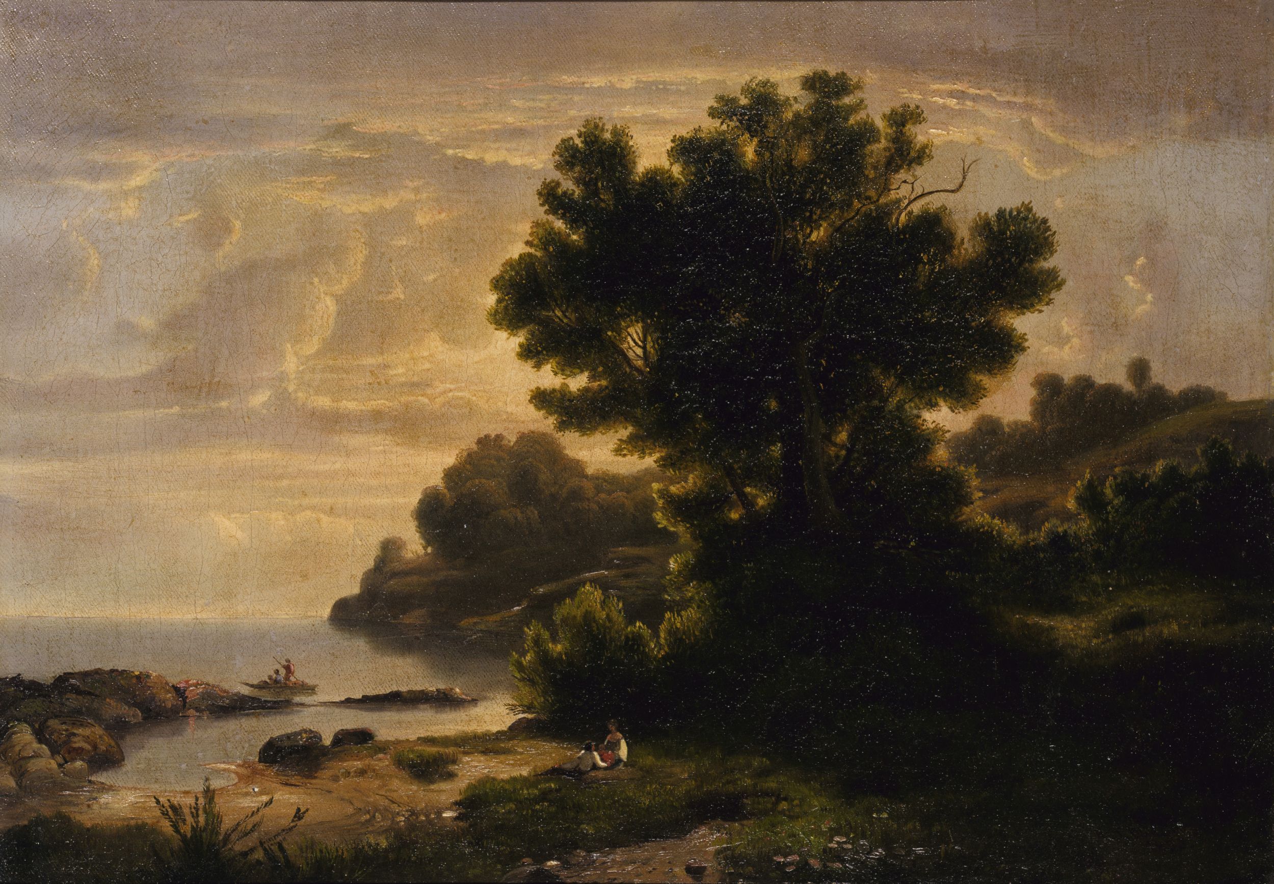 Classically composed landscape painting with an overall golden tone. Beyond a courting couple in the foreground is a body of water, with two young people poling a small boat.